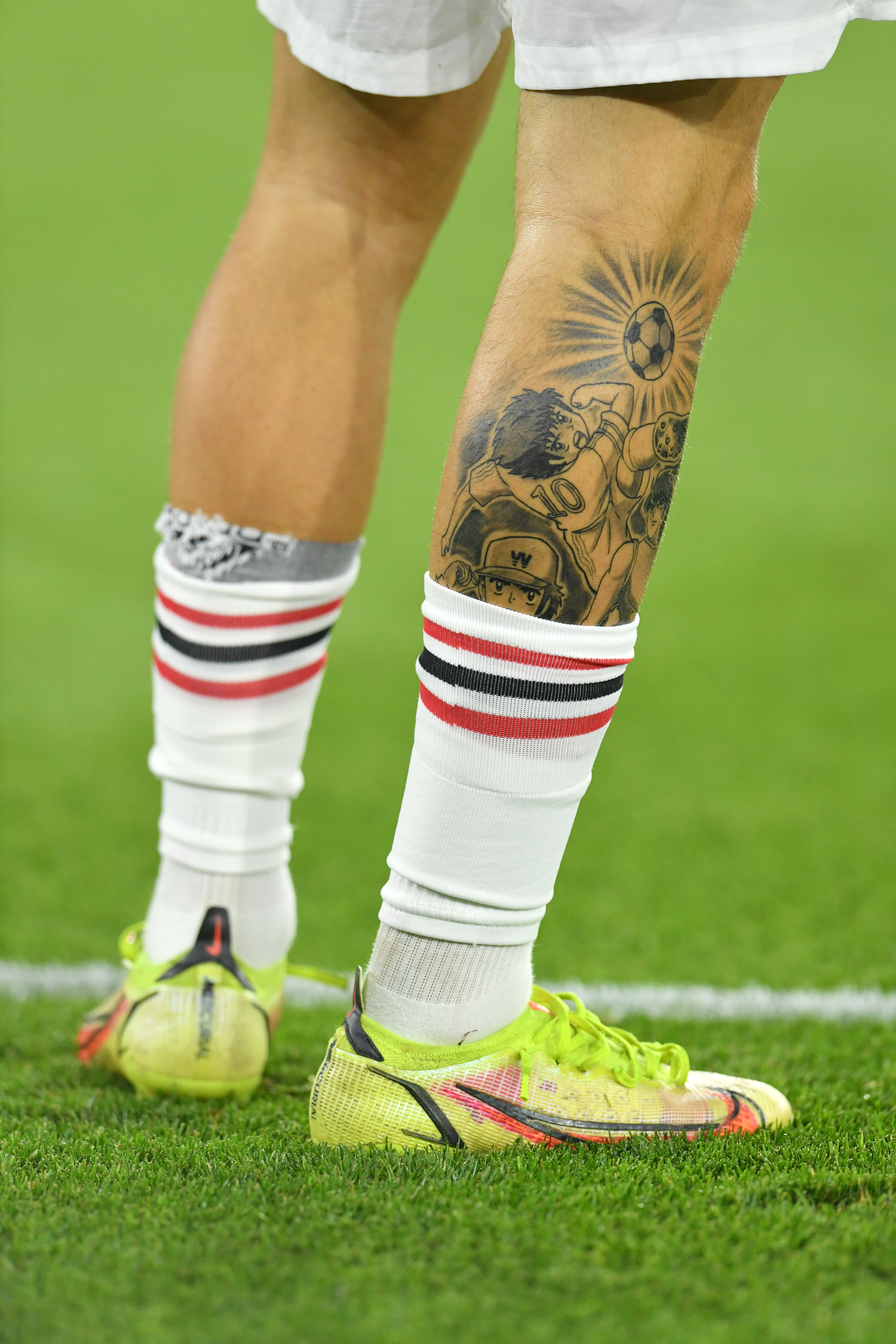 The fresh ink is visible above Garnacho's sock line