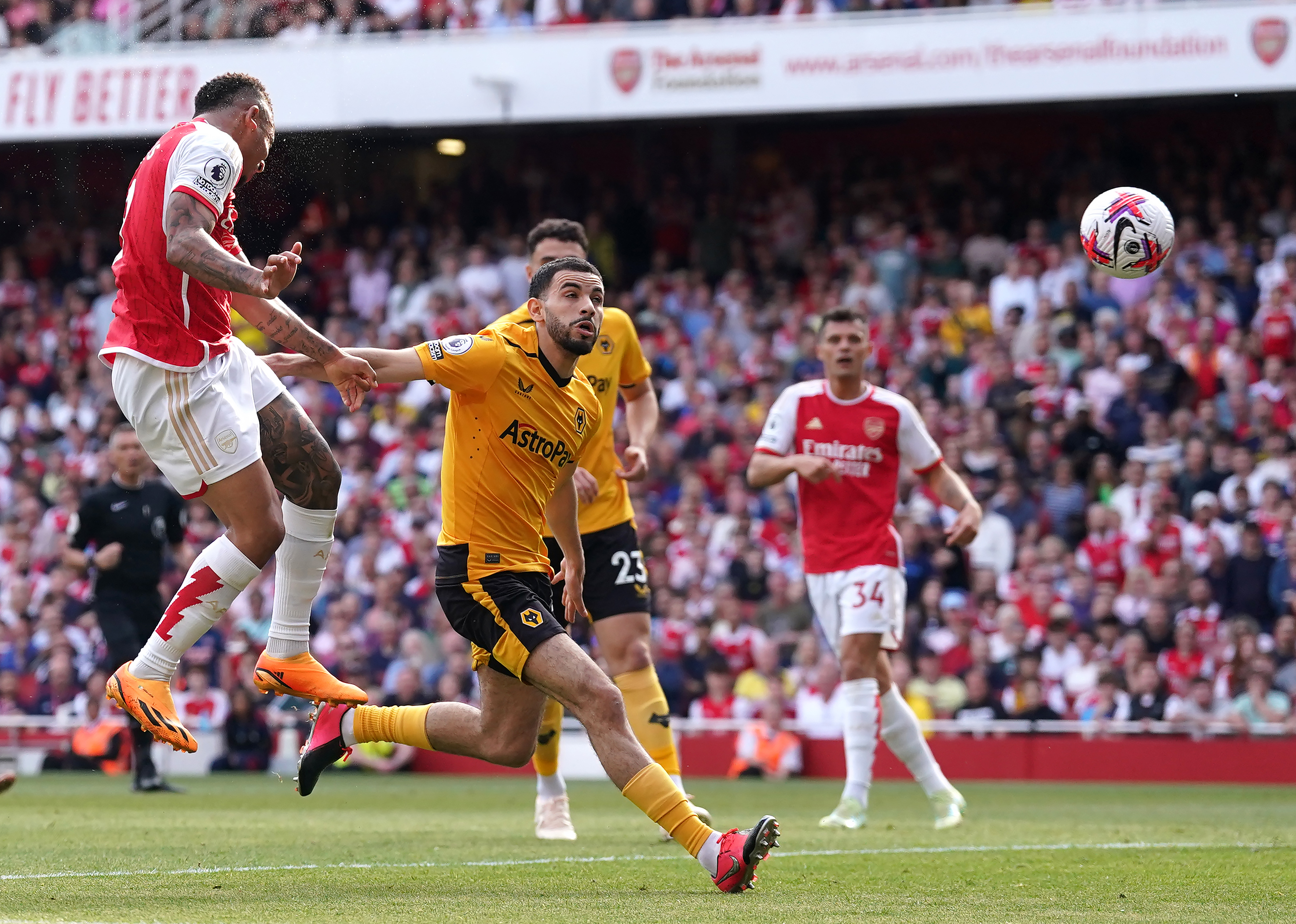 Gabriel Jesus (left) scores Arsenal's fourth goal against Wolves