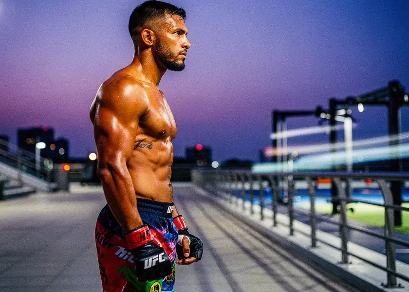 Khamzat Chimaev in the UFC octagon during a welterweight bout in 2026, hands raised