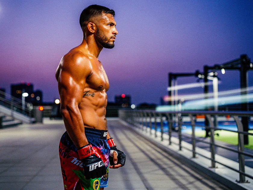 Khamzat Chimaev in the UFC octagon during a welterweight bout in 2026, hands raised