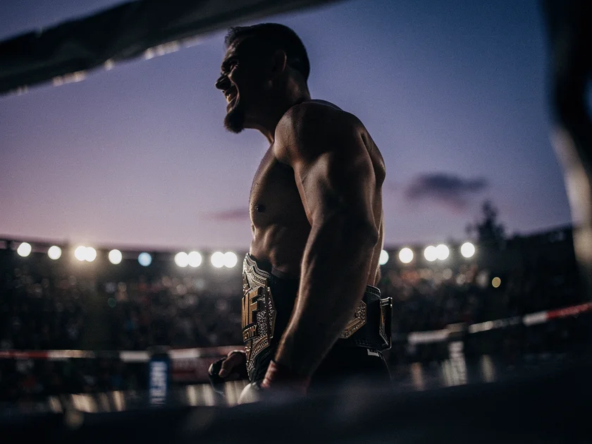 Max Holloway holding the BMF title belt ahead of UFC 326 rematch against Charles Oliveira in Las Veg