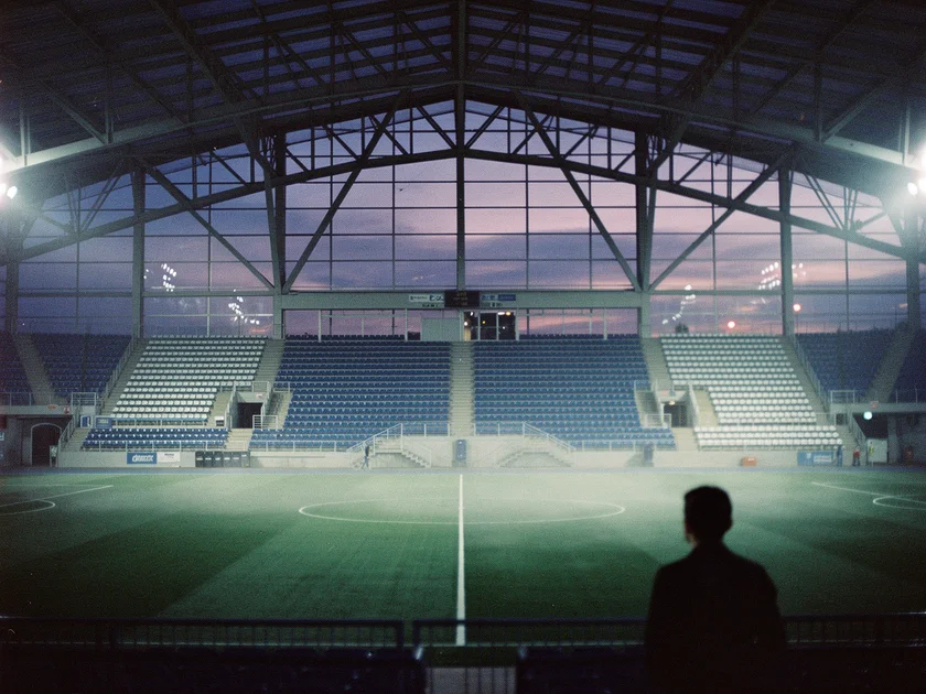 Max Holloway holding the UFC BMF title belt at a press conference before his next fight