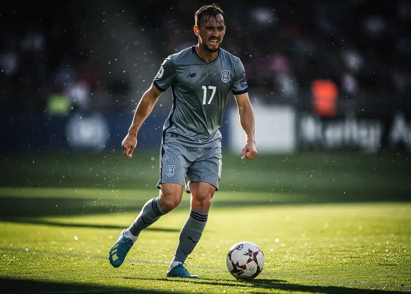 Declan Rice in Arsenal kit driving forward with the ball during a Premier League match in 2026