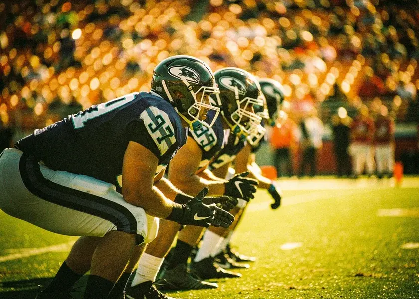 Manchester City and Arsenal players contesting possession in the Premier League Title Race at the Etihad Stadium