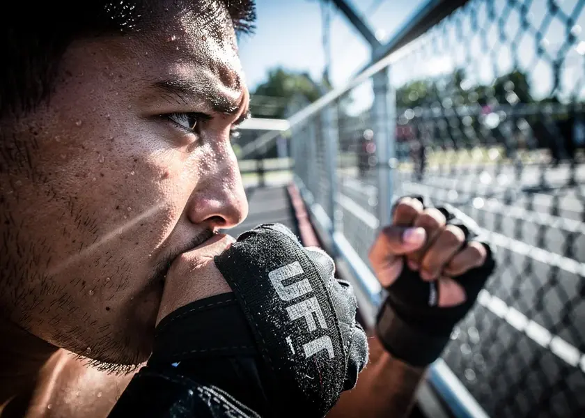 Conor McGregor throwing a left hand in exhibition boxing, highlighting UFC injuries and 2026 return