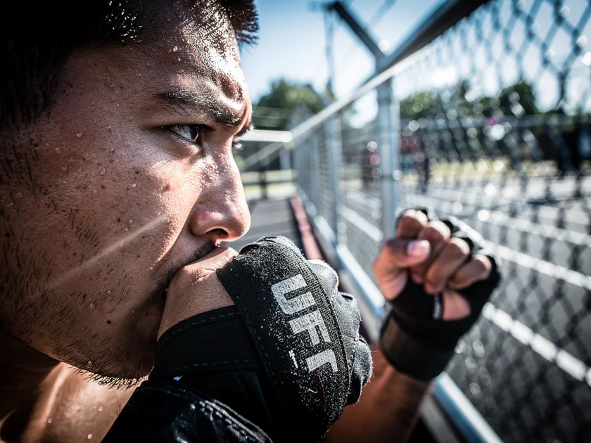 Conor McGregor throwing a left hand in exhibition boxing, highlighting UFC injuries and 2026 return